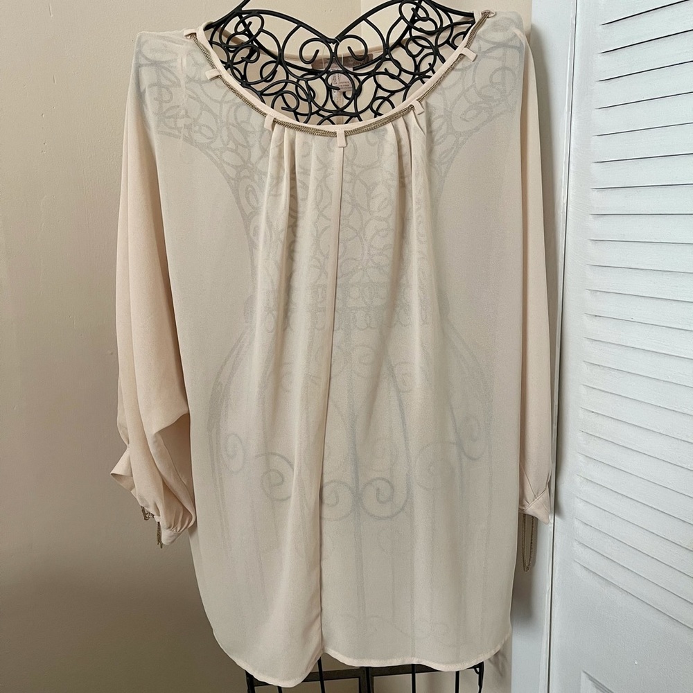 Sheer blouse with chain embellishment